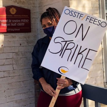 woman hold picket sign